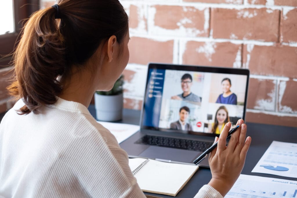 business woman freelancer on a zoom call with clients and team members